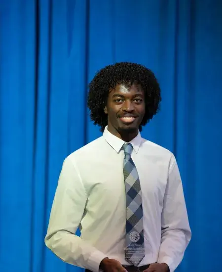 Tayshawn Juantez Gooch winning the 2025 Lyman T. Johnson Torch Bearer Award