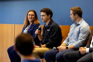 A panel of industry professionals speak with students at a Gatton Global Week event.