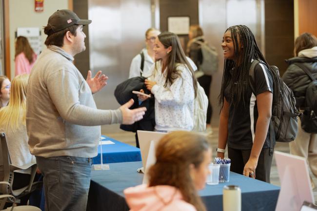 Students have a conversation during the student organization tabling event during Gatton Leadership Week