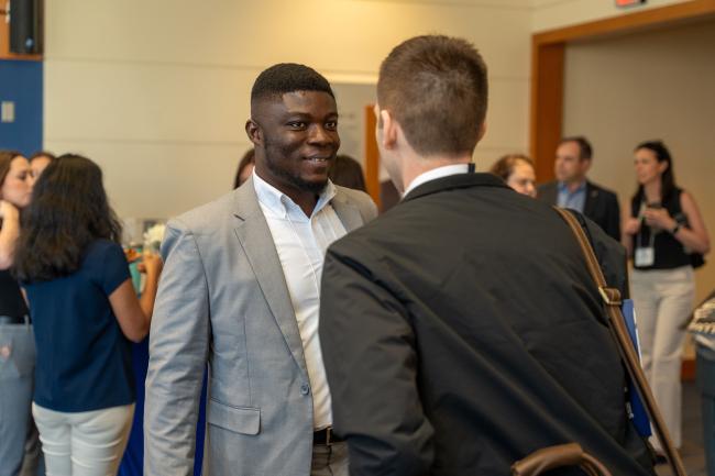 A student speaks to an industry professional at the annual Supply Chain Forum, hosted at the University of Kentucky
