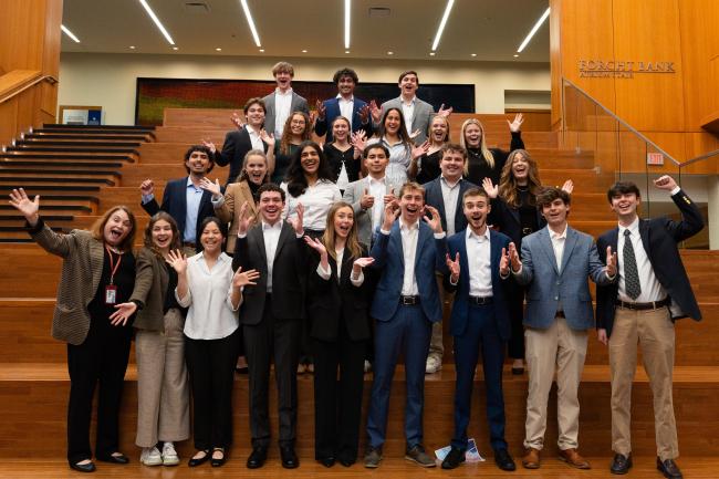 Gail Hoyt's Economics of Altruism course pose for a class photo as they all celebrate