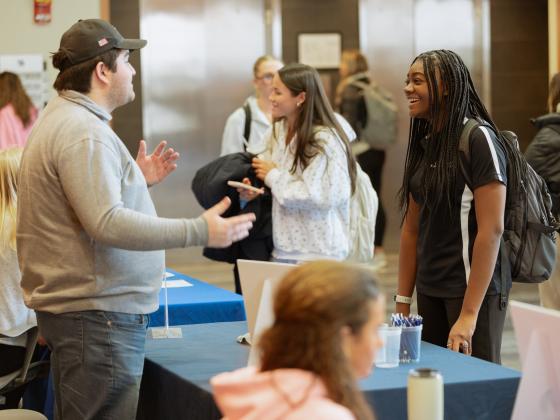 Students have a conversation during the student organization tabling event during Gatton Leadership Week