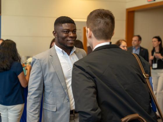 A student speaks to an industry professional at the annual Supply Chain Forum, hosted at the University of Kentucky