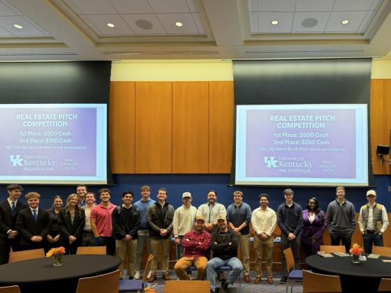 Members of the Real Estate Club pose for a group picture after the first Real Estate Pitch Competition. Shaun Sanders, director for the Center for Real Estate, stands with the group of students.