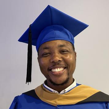 Ephraim Njeri in Graduate cap and gown